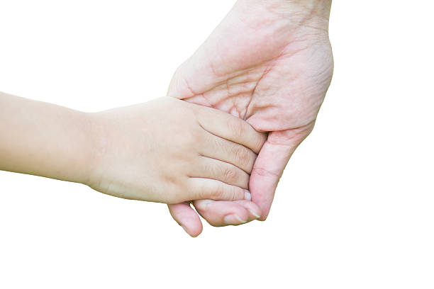 istock Mother holding a hand of his son on white background 475767906