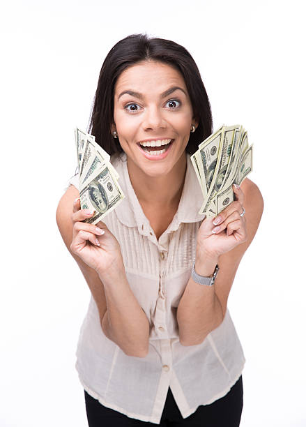 istock Laughing young woman holding money 475767940