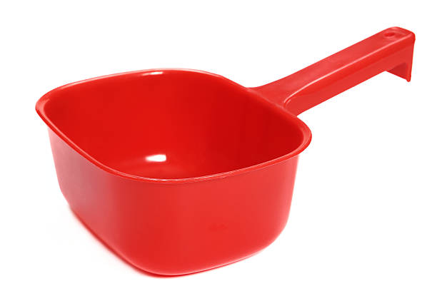 istock Plastic ladle of red on a white background 475768124
