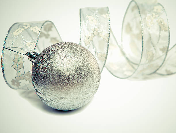 istock Beautiful silvery New Year's ball and elegant tinsel 475774412