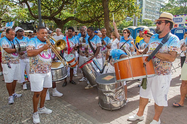 Ipanema band parading in Rio Rio de Janeiro, Brazil - February 19, 2011: Ipanema Band starts its traditional parade in Gomes Carneiro Street in Ipanema.  nudie suit stock pictures, royalty-free photos & images