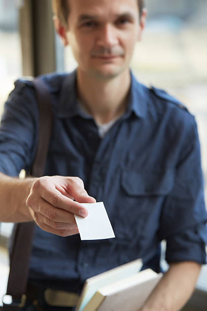 istock businessman giving a business card 475774774