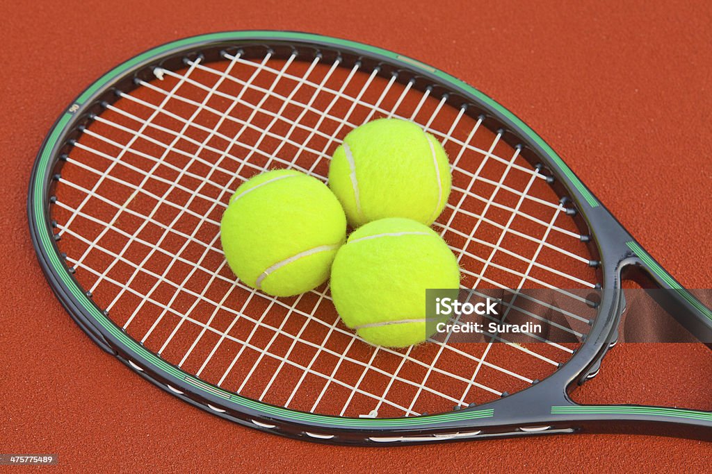 Tennis court with ball and racket Activity Stock Photo