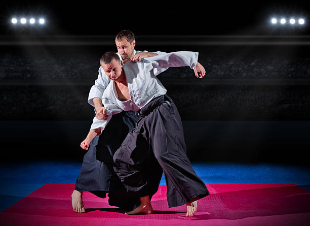 istock Fight between two martial arts fighters 475775844