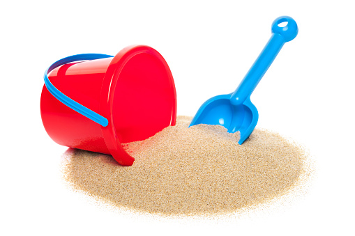 Toy bucket and spade isolated on white background 