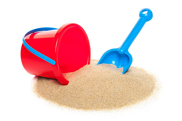 Toy bucket and spade Toy bucket and spade isolated on white background  sand pail and shovel stock pictures, royalty-free photos & images