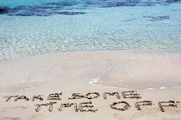 istock TAKE SOME TIME OFF written in sand on a beach 475778861