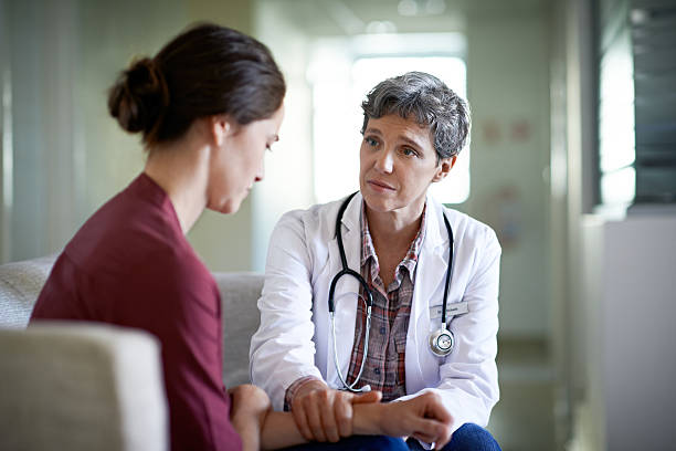 Her compassion is just what the doctor ordered Shot of a compassionate doctor comforting a young woman in a hospital waiting roomhttp://195.154.178.81/DATA/i_collage/pu/shoots/804719.jpg shock stock pictures, royalty-free photos & images