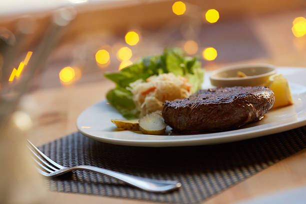 istock steak with sauce and vegetables 475780674