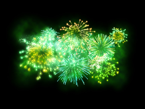 Fireworks show with exploding colorful lights, isolated on a black background sky. Green and glowing fireworks illuminating a St. Patrick's Day celebration event. Digital composite image including real and digital generated fireworks.