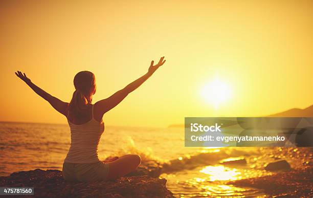 Yoga At Sunset On Beach Woman Doing Yoga Stock Photo - Download Image Now - Zen-like, Yoga, Sunset