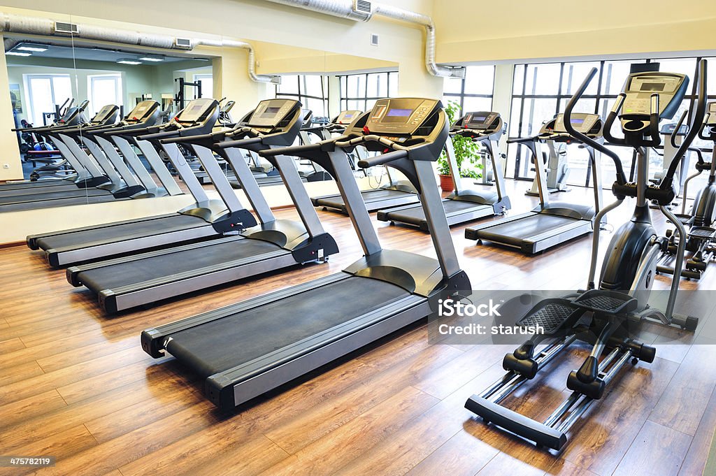 Treadmills in the gym Set of treadmills staying in line in the gym Health Club Stock Photo