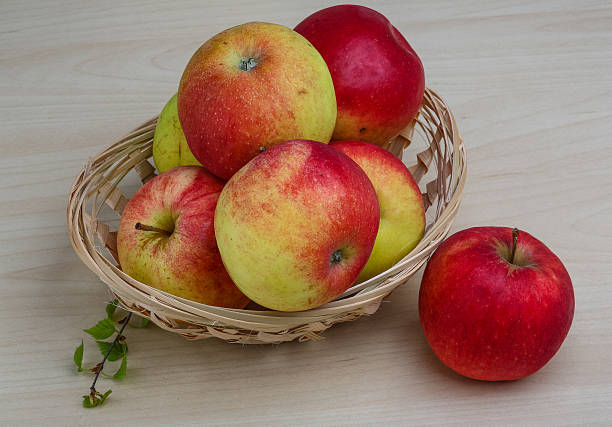 Few apples Few apples in the basket on wood backgrond ragweed stock pictures, royalty-free photos & images