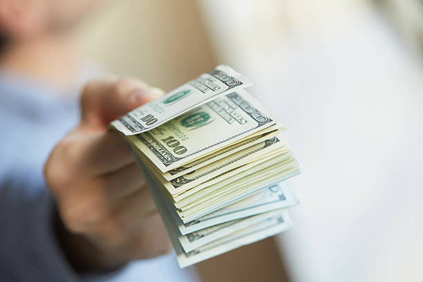 istock money in hand 475784960