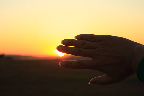 ハンドサインシルエット - human hand light reaching assistance ストックフォトと画像