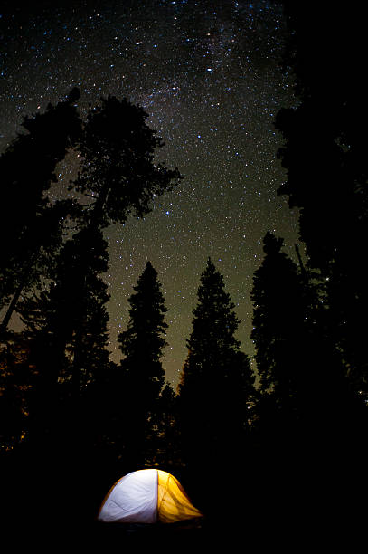 Tent camping below a starry sky stock photo