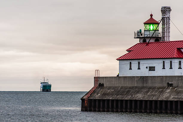 Oar boat approaches Duluth Harbor stock photo