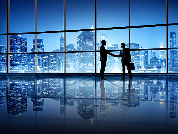 istock Two Business Person Shaking Hands 475790151
