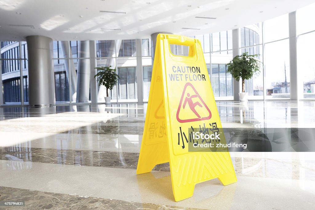 hallway with a caution sign in English Advice Stock Photo