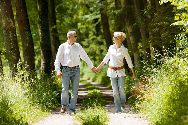 istock Happy senior couple outdoors running 475794913