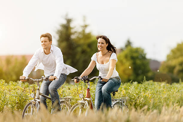 istock young couple cycling with bicycle in summer 475797485