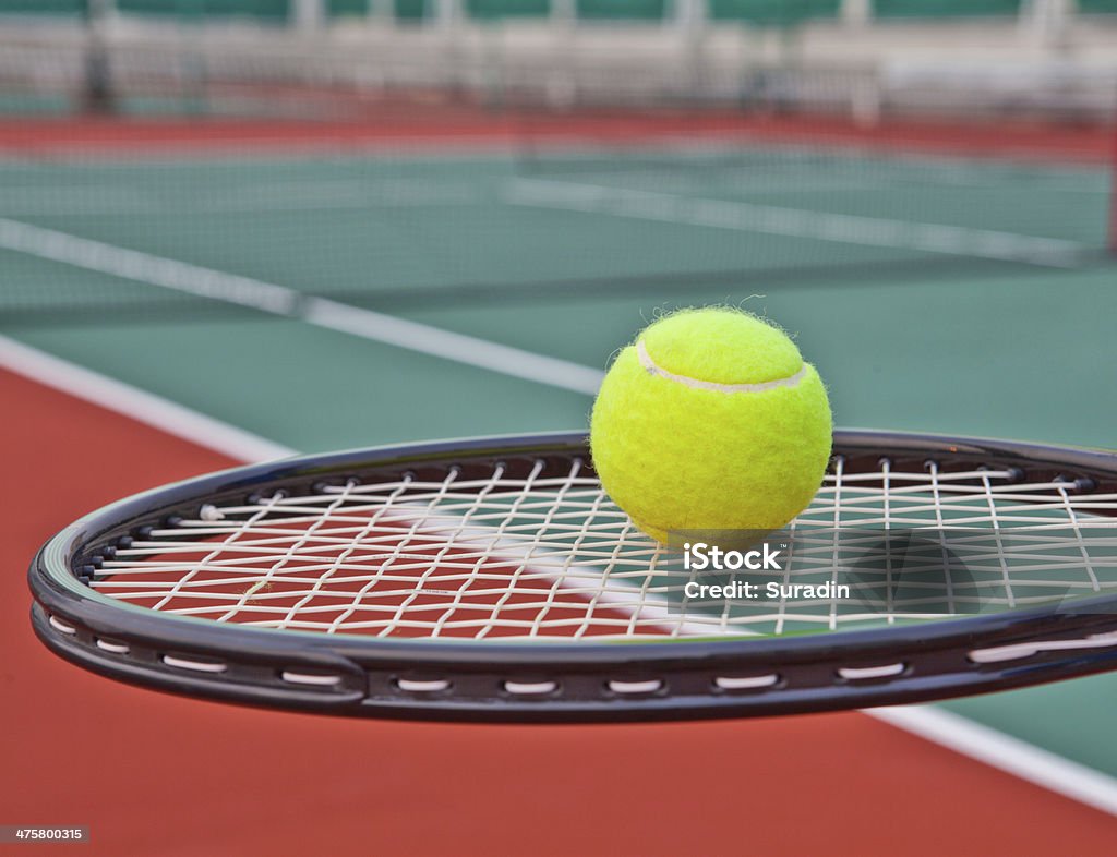 Tennis court with ball and racket Activity Stock Photo