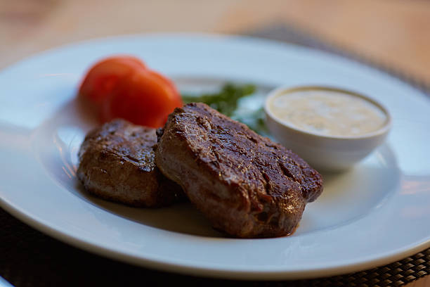 istock steak with sauce and vegetables 475800758