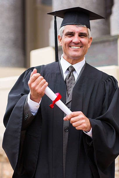 istock middle aged male graduate 475804693