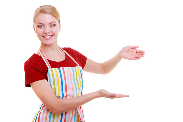 istock housewife waitress inviting welcome gesture kitchen apron isolated 475811565
