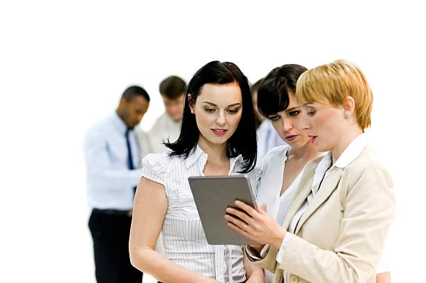 istock Three businesswoman working on a touchpad 475813627