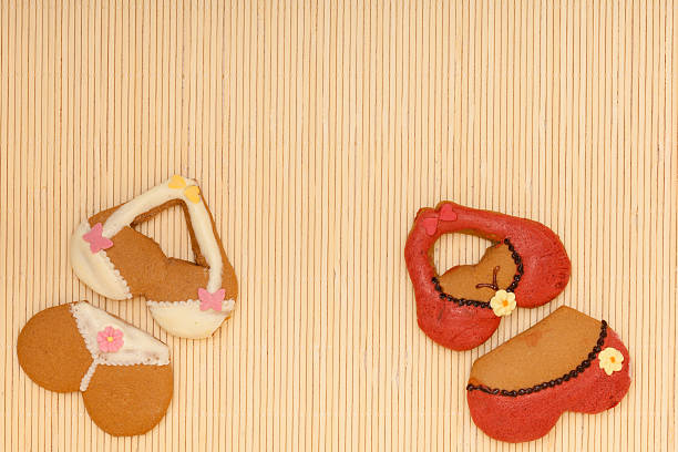 istock Funny colorful bikini shape gingerbread cakes cookies on bamboo mat 475813757
