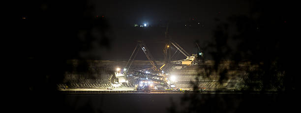 istock bucket-wheel excavator at night in open-cast coal mining hambach 475814788