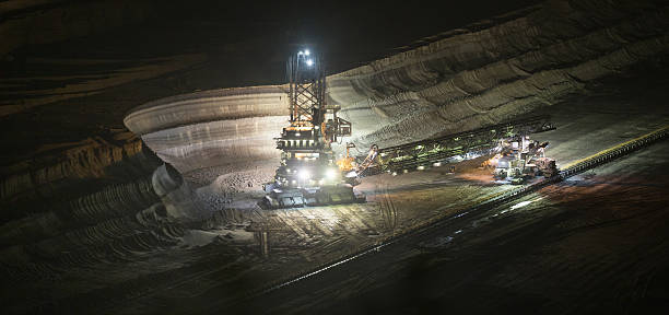 istock bucket-wheel excavator at night in open-cast coal mining hambach 475814796