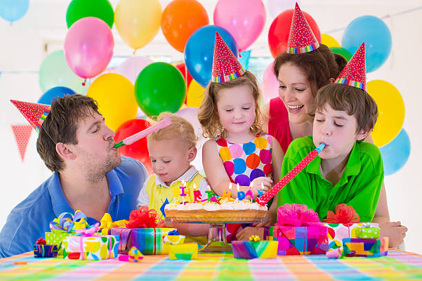 istock Family celebrating birthday party 475819090