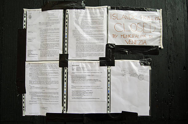 Official notices on Closed Iceland Pavilion, Venice Venice, Italy - May 26, 2015:  Official notices forcing the closure of the Iceland Pavilion a the Venice Biennale art exhibition. The controversial exhibit involved creating a mosque inside a Catholic Church.   venice biennale stock pictures, royalty-free photos & images