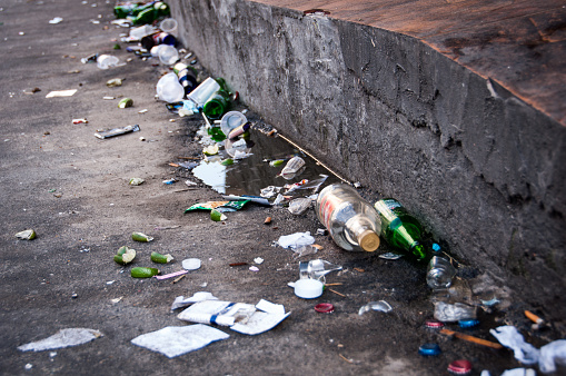 Nova Iguacu, Rio de Janeiro, Brazil - April 12, 2015: Streets full of trash after heavy saturday night partying in the city.