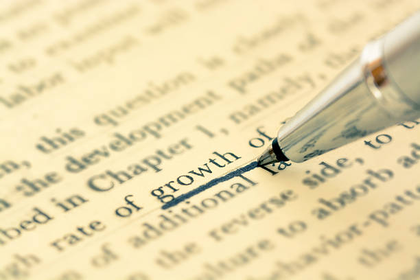 istock Pen emphasis on increase word in old book 475826416