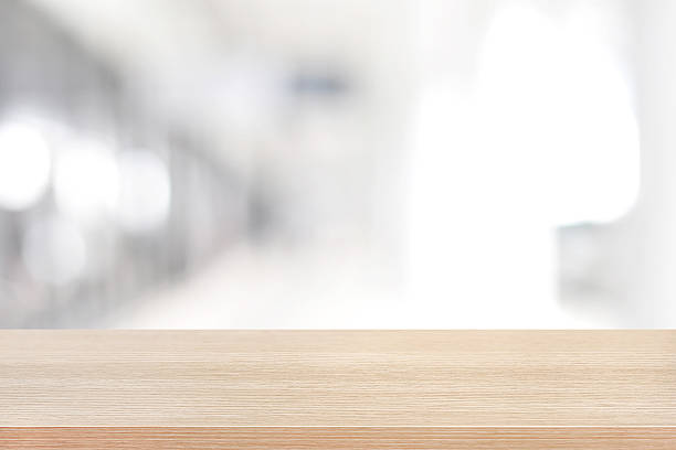 istock Wood table top on blurred white gray background 475827178