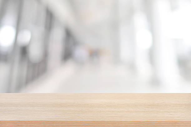 istock Wood table top on blurred white gray background 475827206