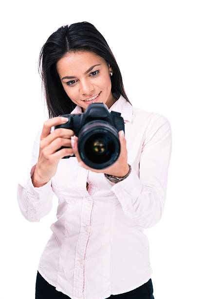 istock Smiling woman photographer with camera 475828606