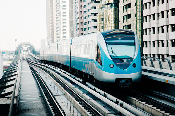 istock Dubai metro train with apartment buildings, daytime, nobody 475828608