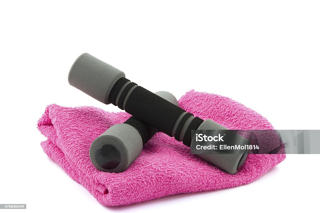 two dumbbells on a towel two grey dumbbells on a pink towel isolated Activity Stock Photo