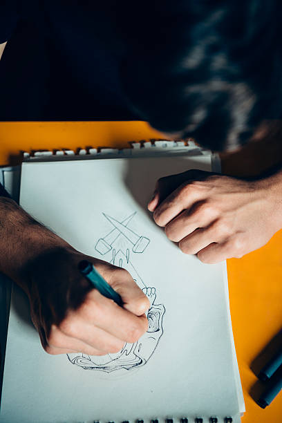 istock Tattoo Artist Drawing 475832824