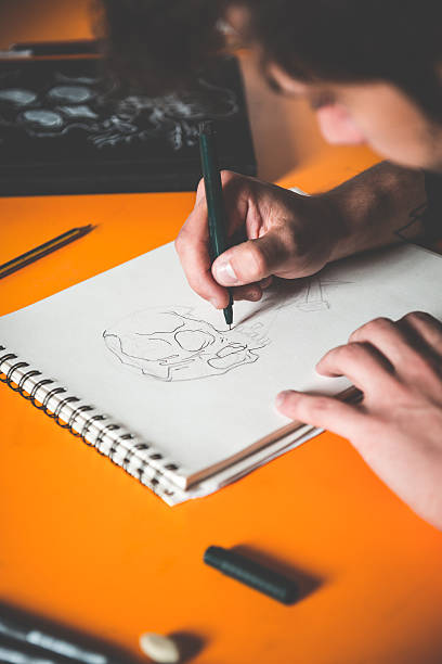 istock Tattoo Artist Drawing 475832864