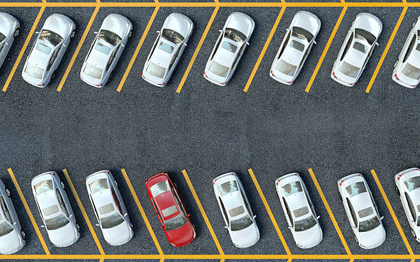 istock parked red car among the white car. 475833580