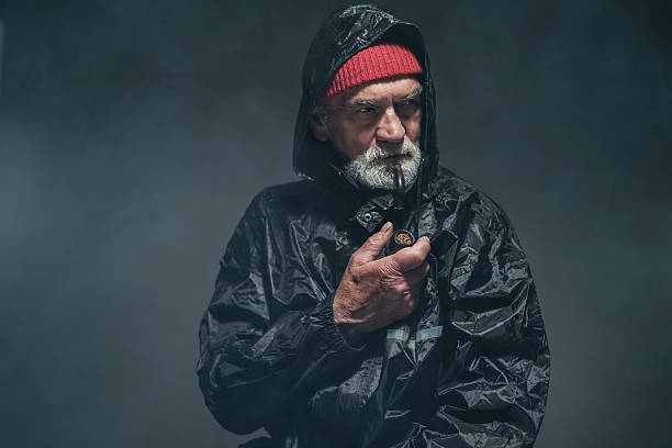 istock Bearded Old Man in Winter Outfit with Smoking Pipe 475833638