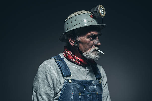 istock Elderly Gold Miner with Smoke Facing Right 475833650