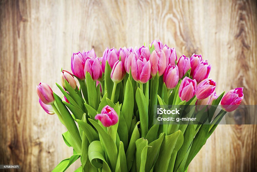 Bouquet of tulips Bouquet of tulips on wooden background Bouquet Stock Photo