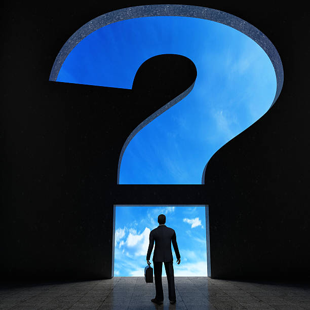 istock person walking through narrow passage in shape of question mark 475834528