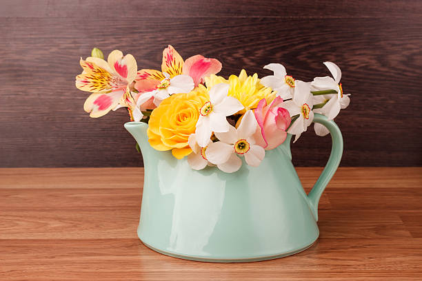 istock Light blue teapot with flowers 475834756